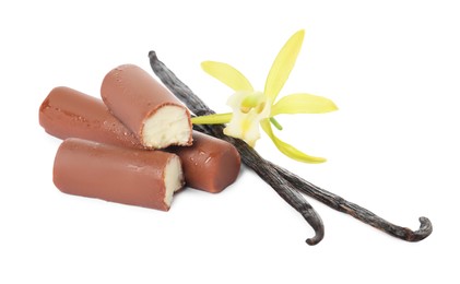 Photo of Glazed curd cheese bars, vanilla pods and flower isolated on white