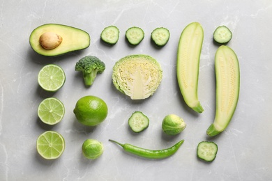 Photo of Flat lay composition with fresh vegetables and fruits on light background