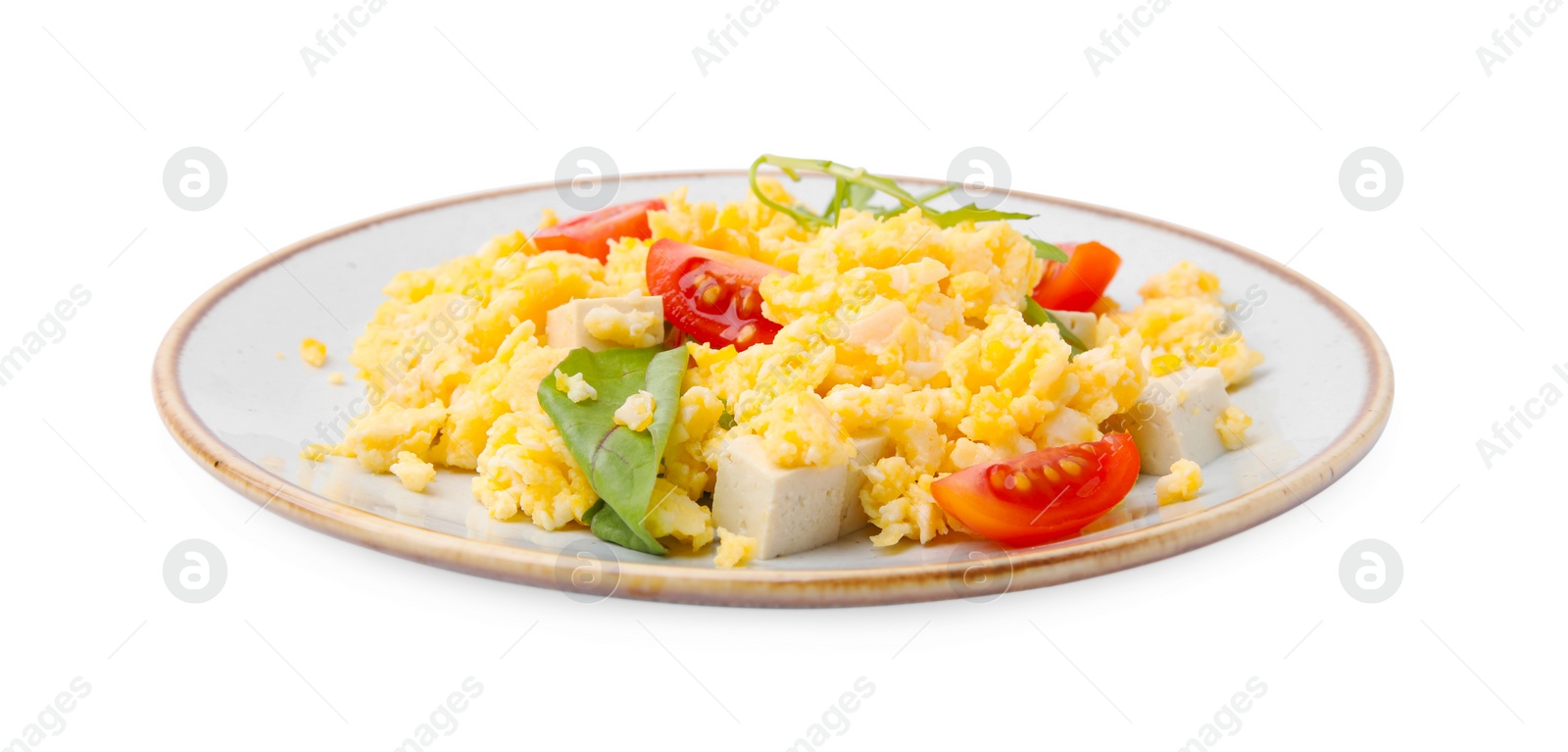 Photo of Plate of delicious scrambled eggs with tofu and tomatoes isolated on white