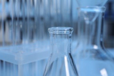 Photo of Laboratory analysis. Different glassware on table indoors, closeup