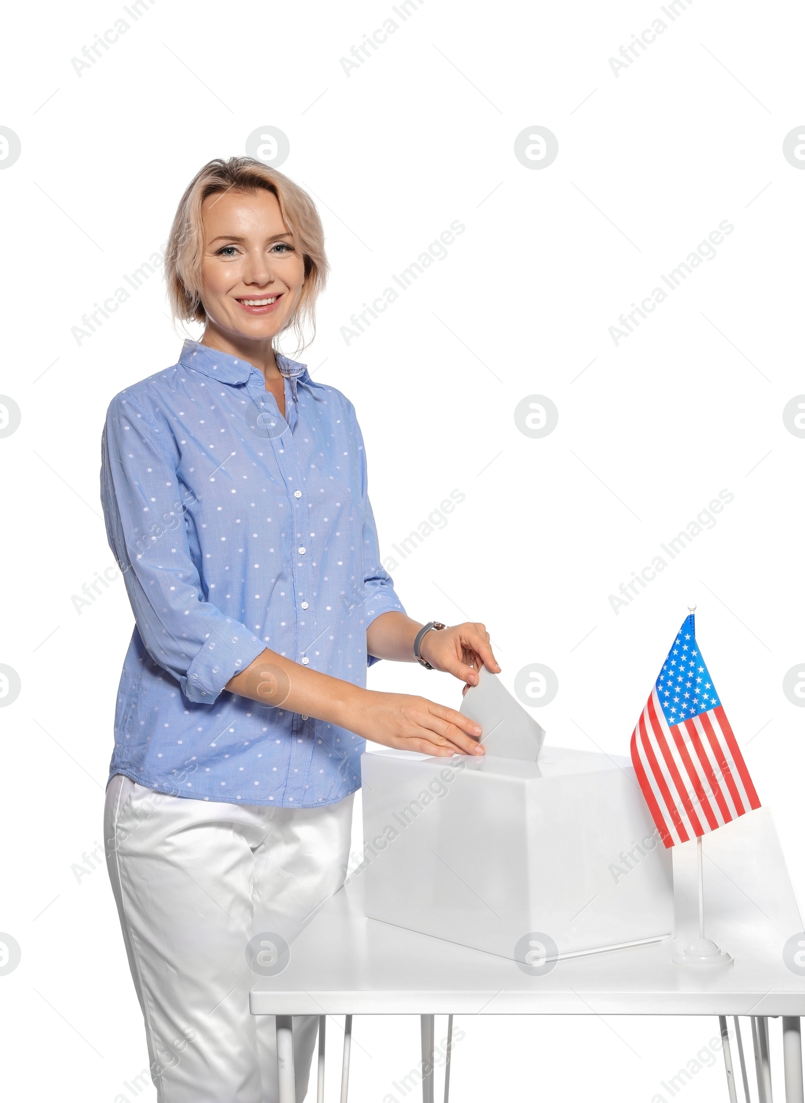 Photo of Woman putting ballot paper into box against white background