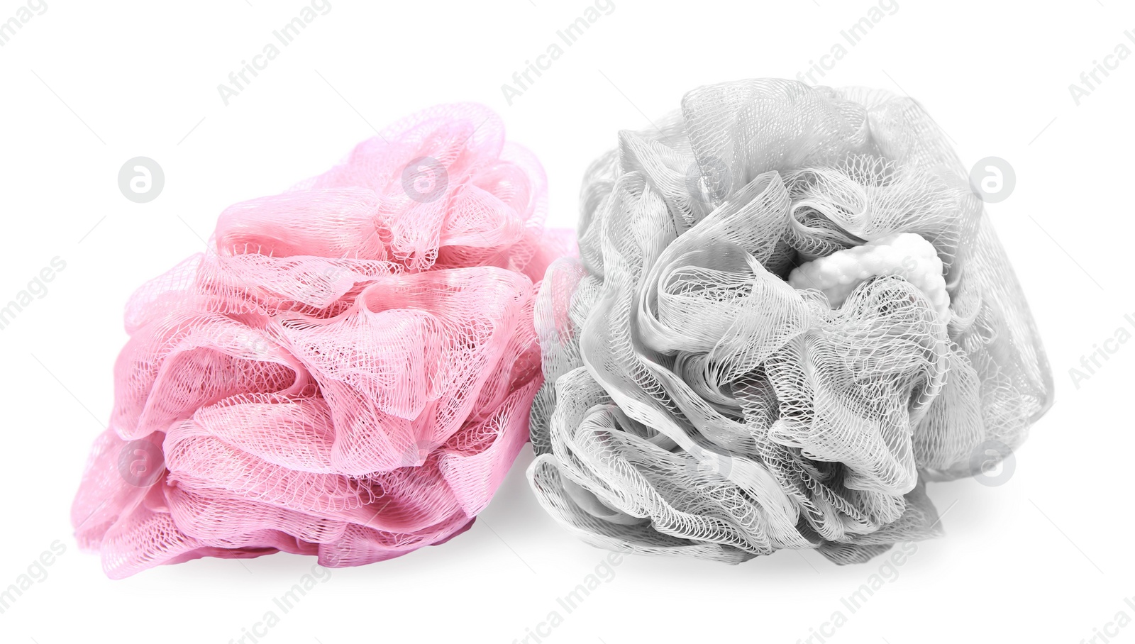 Photo of New shower puffs on white background. Personal hygiene