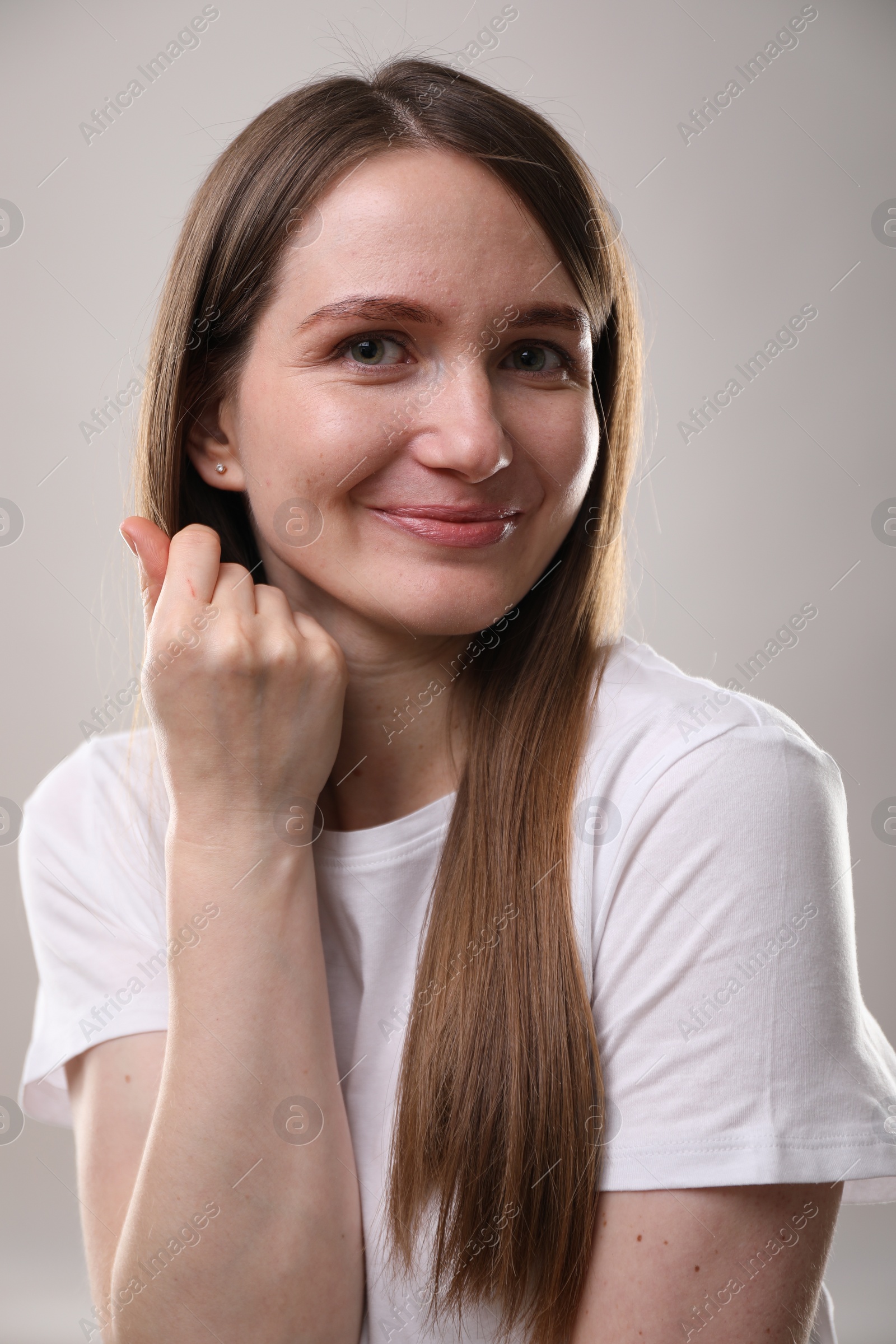 Photo of Portrait of beautiful woman on gray background