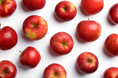 Photo of Ripe juicy red apples on white background, top view