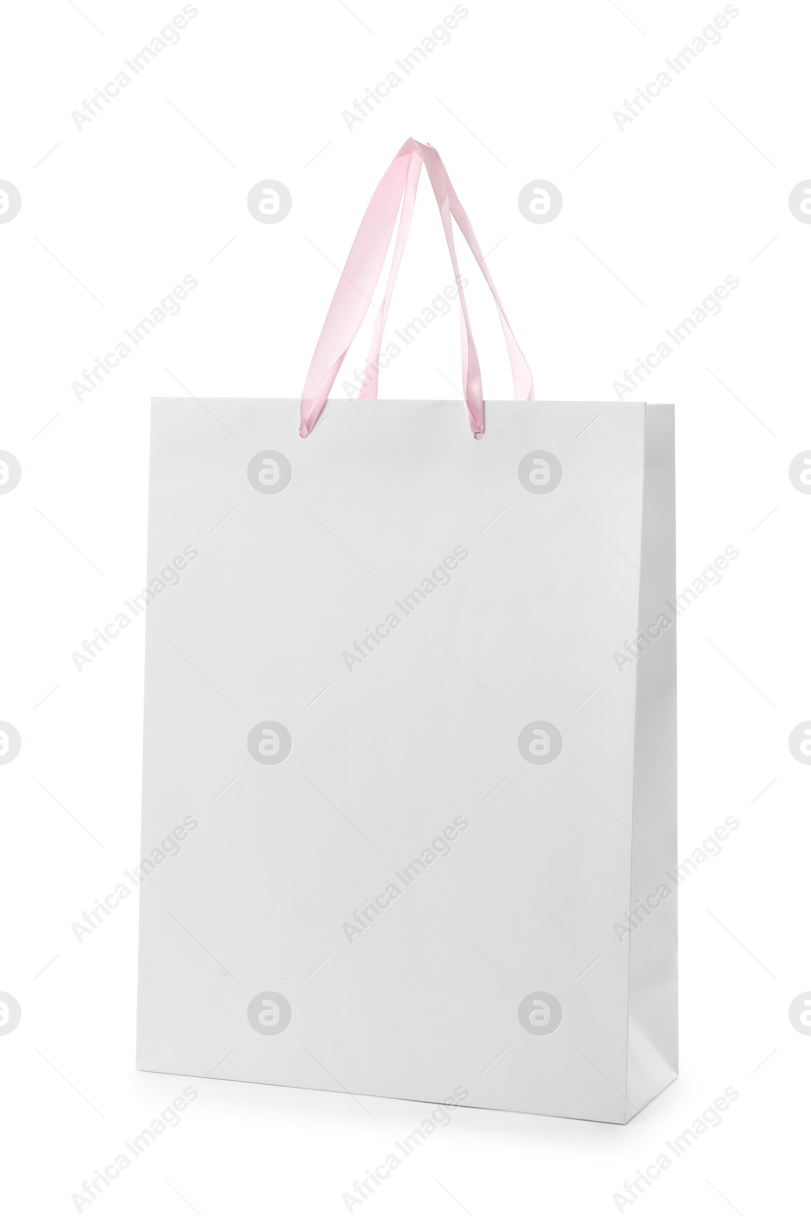 Photo of Paper shopping bag with handles on white background. Mockup for design