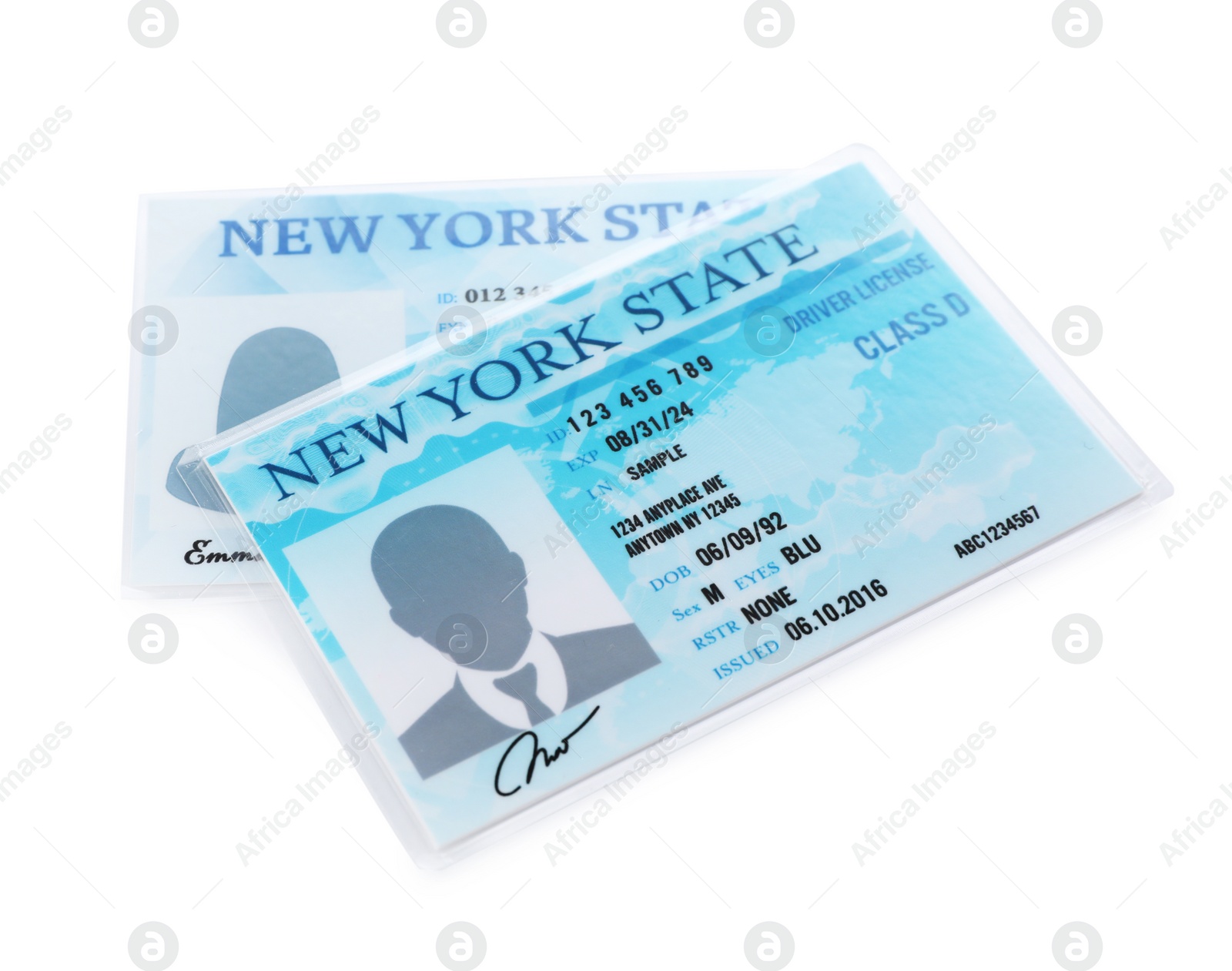 Photo of New American driving licenses on white background