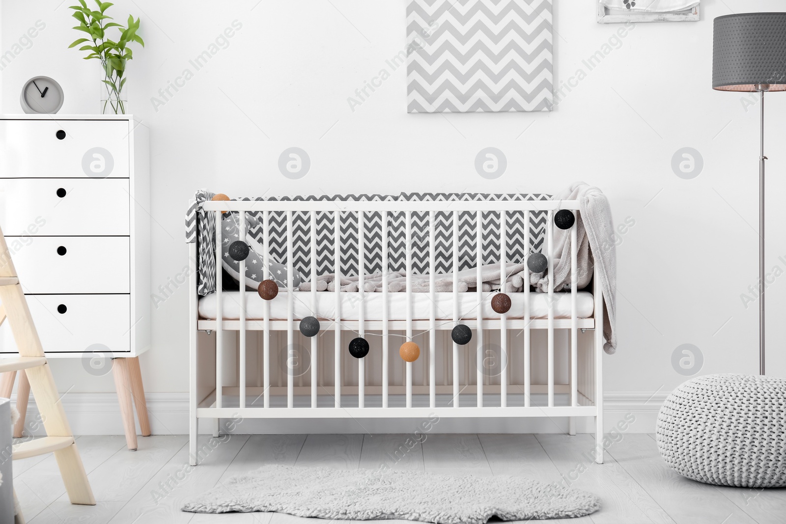 Photo of Baby room interior with comfortable crib