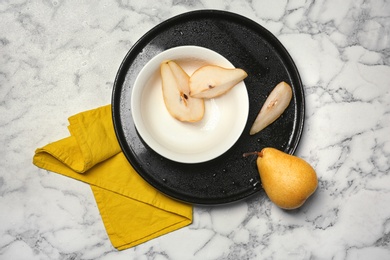 Flat lay composition with ripe pears on marble background