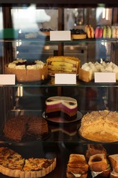 Counter with delicious pastries and sandwiches in cafe