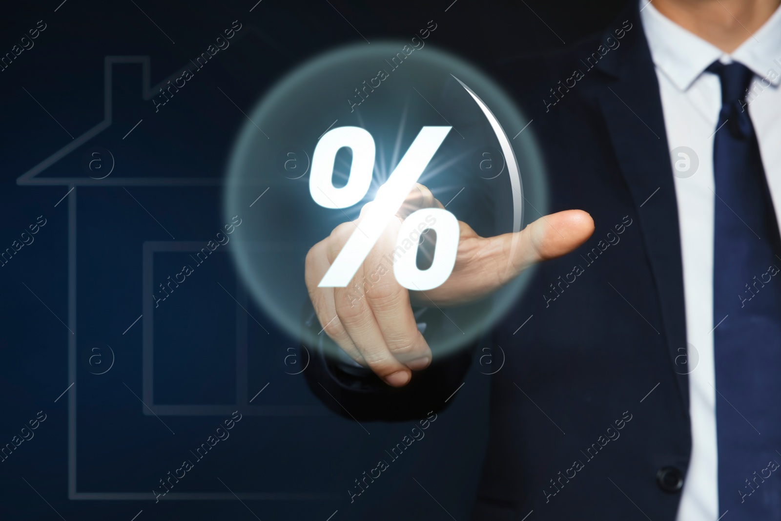 Image of Mortgage. Man pressing sphere with percent sign against dark blue background, closeup