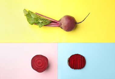 Photo of Whole and cut fresh red beets on color background, flat lay