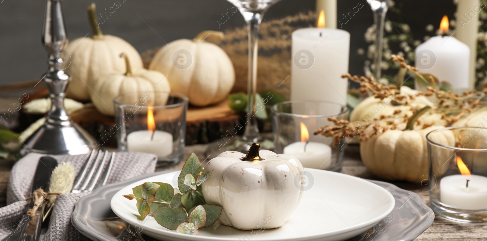 Image of Beautiful autumn place setting and decor on wooden table. Banner design
