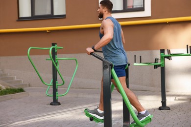 Man training on air walker at outdoor gym