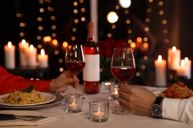 Photo of Couple having romantic dinner in restaurant, closeup