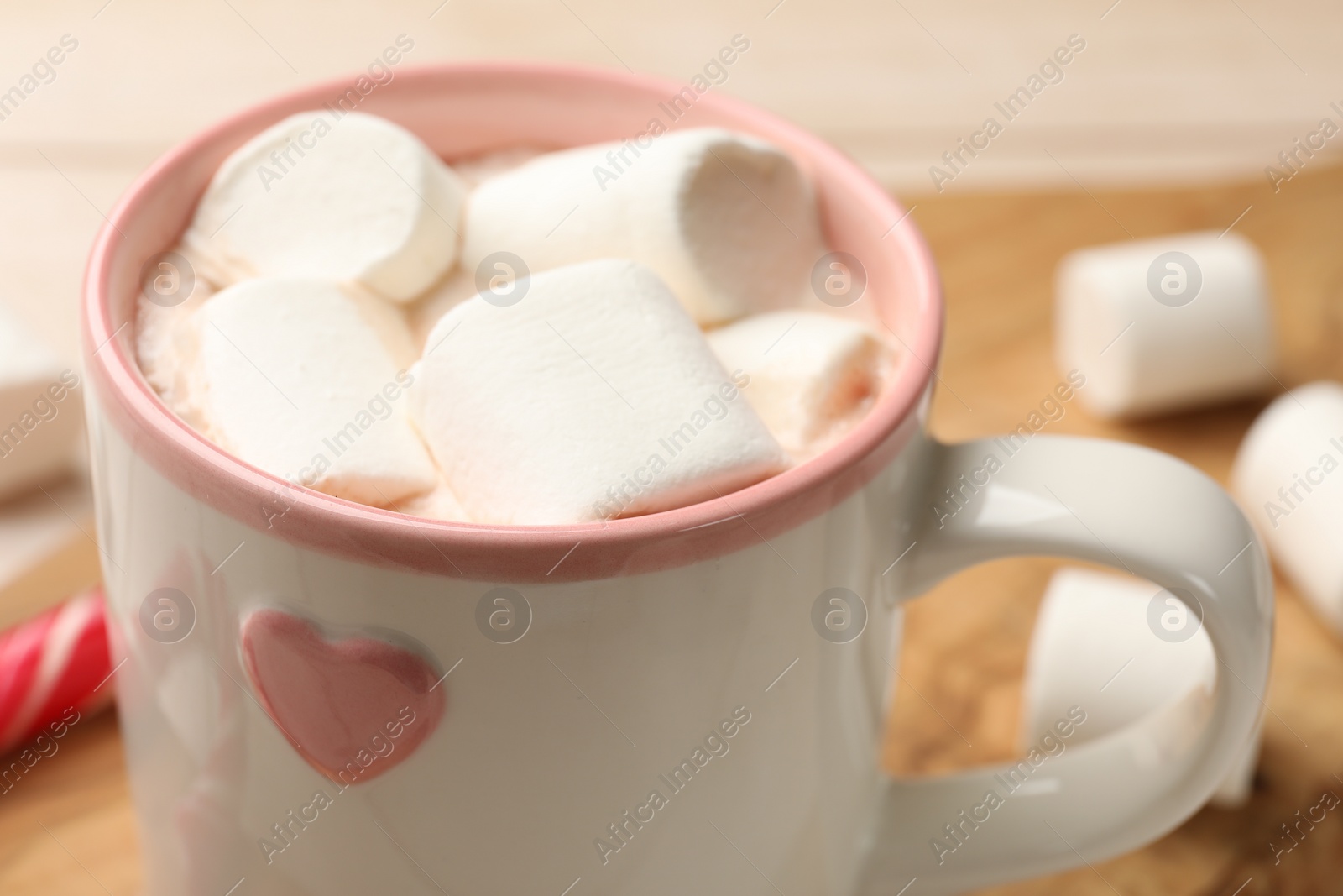 Photo of Tasty hot chocolate with marshmallows on table, closeup