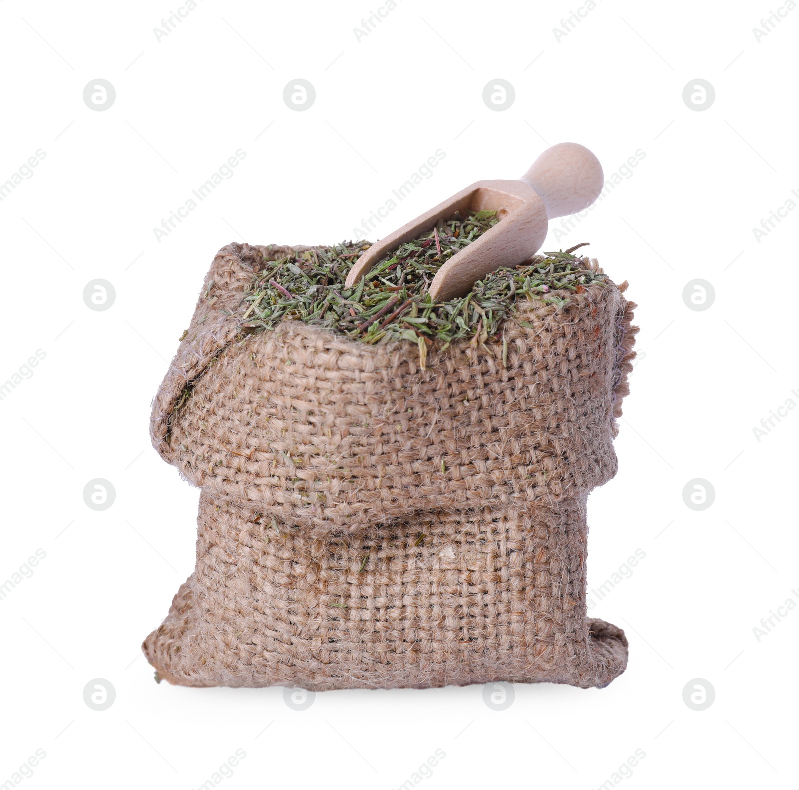 Photo of Sack of dried thyme and scoop isolated on white