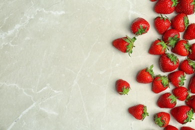 Photo of Ripe red strawberries on light background, top view