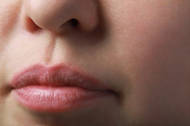 Closeup view of woman with normal skin and beautiful lips