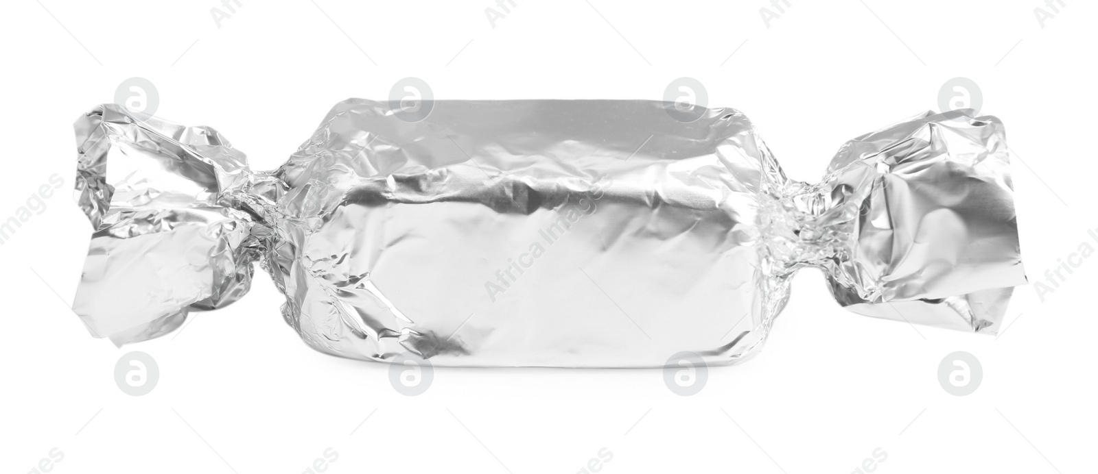 Photo of Tasty candy in silver wrapper isolated on white