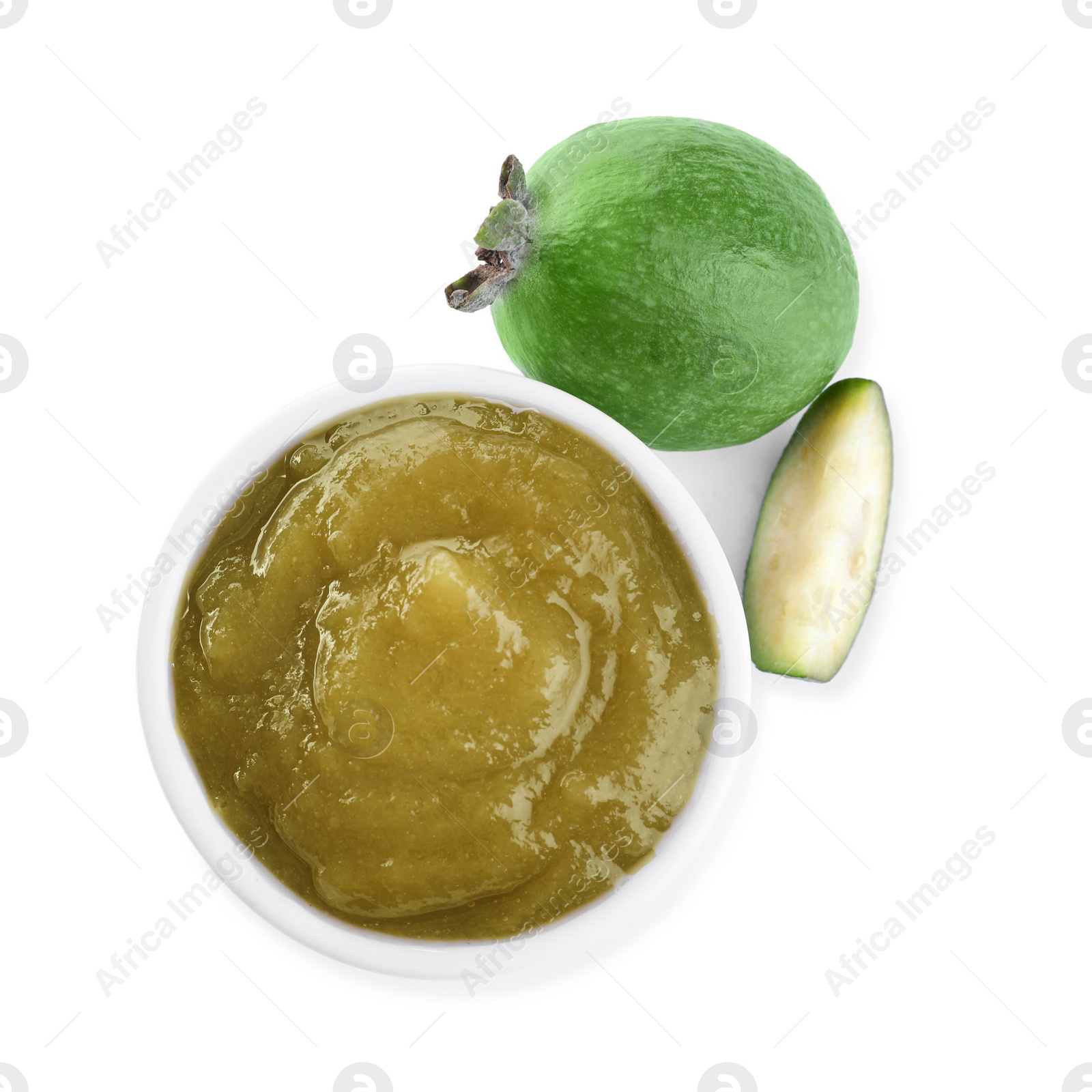 Photo of Feijoa jam in bowl and fresh fruits on white background, top view