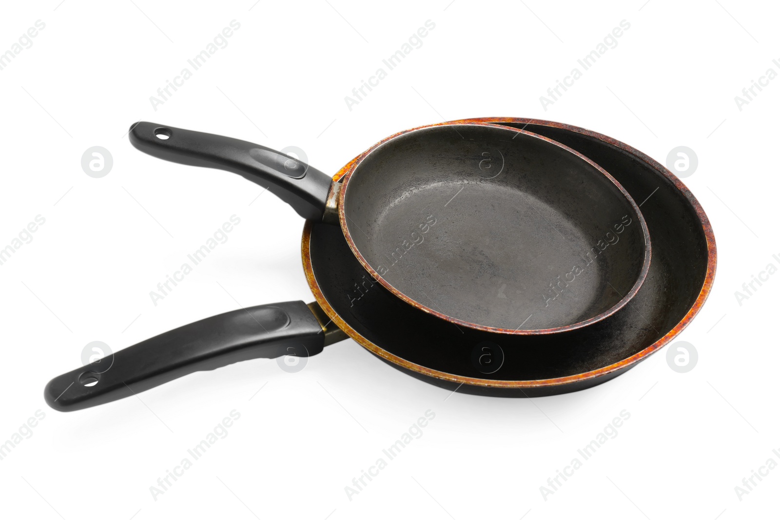 Photo of Dirty old frying pans on white background