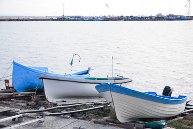 Moored boats on beach near sea outdoors