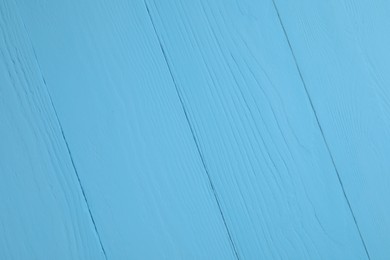 Photo of Texture of light blue wooden surface as background, closeup