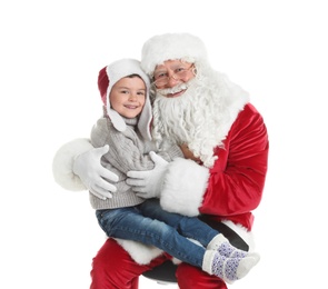 Photo of Little boy hugging authentic Santa Claus on white background