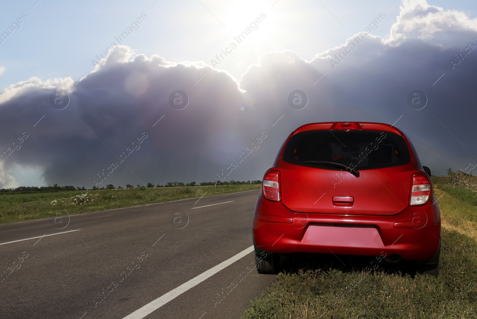 Image of Car on kerb near asphalt road outdoors on cloudy day