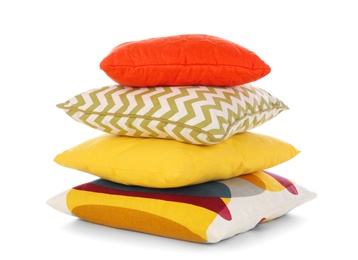 Photo of Stack of different colorful pillows on white background