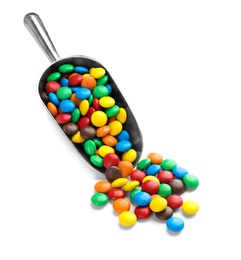 Photo of Scoop with colorful candies on white background