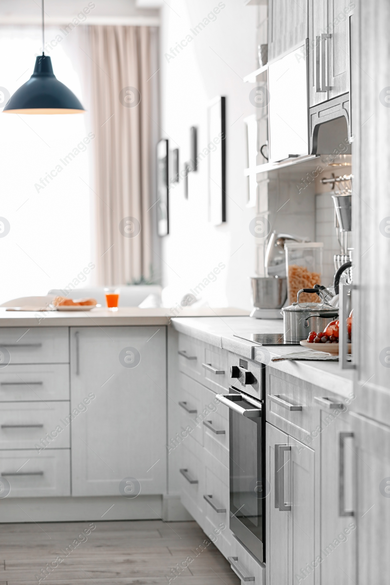 Photo of Modern kitchen interior in light apartment