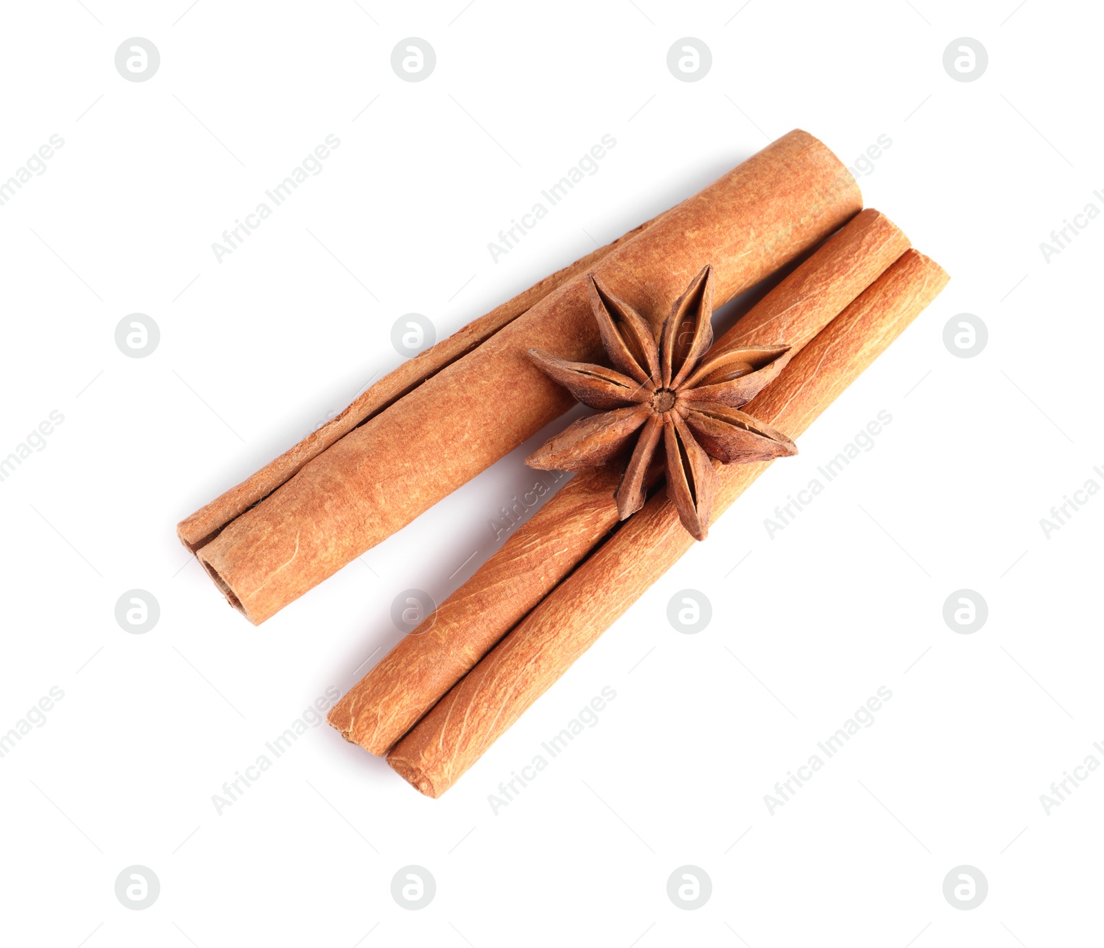 Photo of Cinnamon sticks and anise star isolated on white, top view