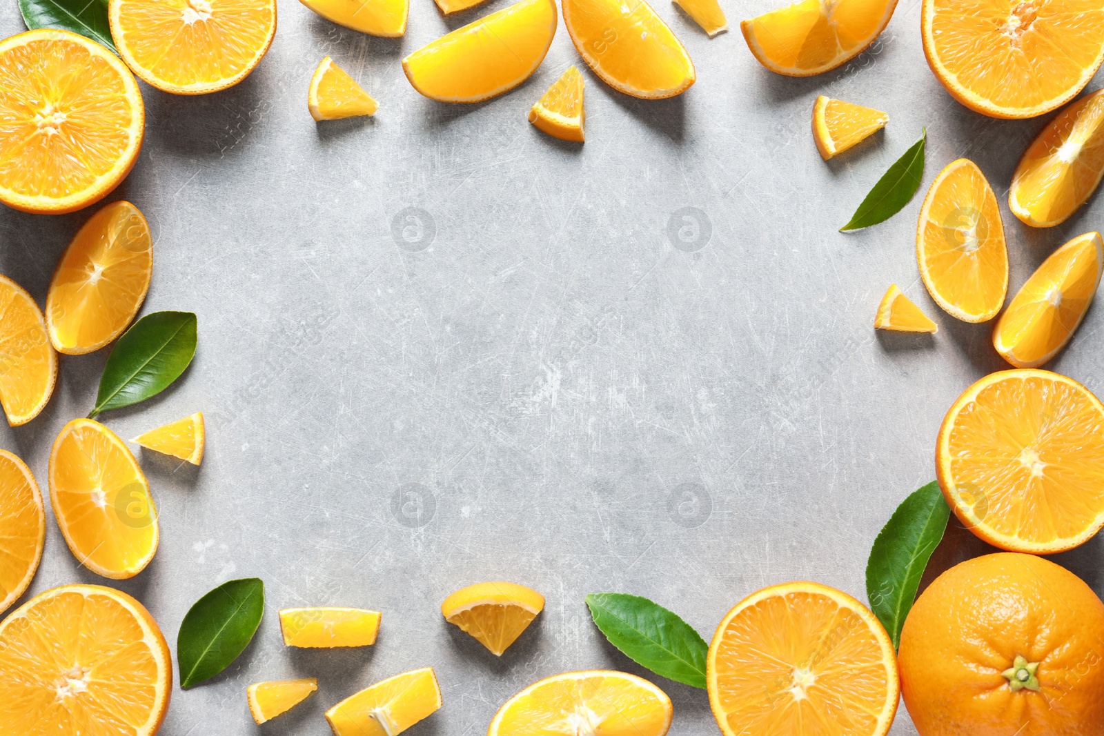 Photo of Flat lay composition with ripe oranges and space for text on grey background