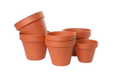 Photo of Empty clay flower pots isolated on white