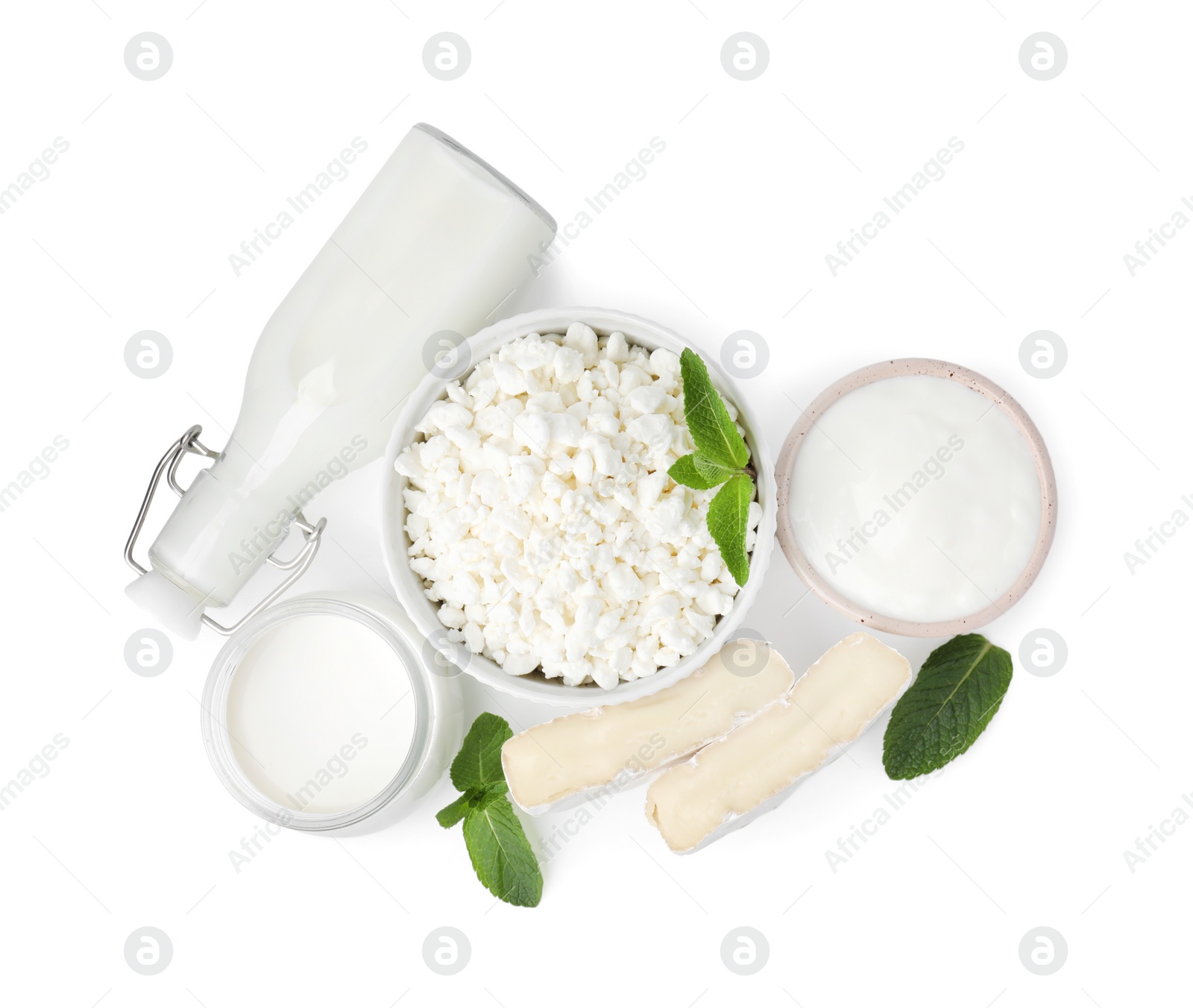 Photo of Different fresh dairy products and mint isolated on white, top view