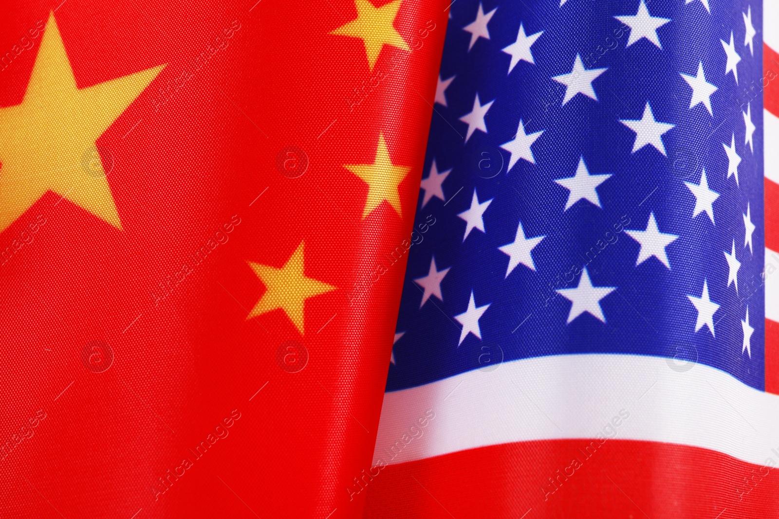 Photo of USA and China flags as background, top view. International relations