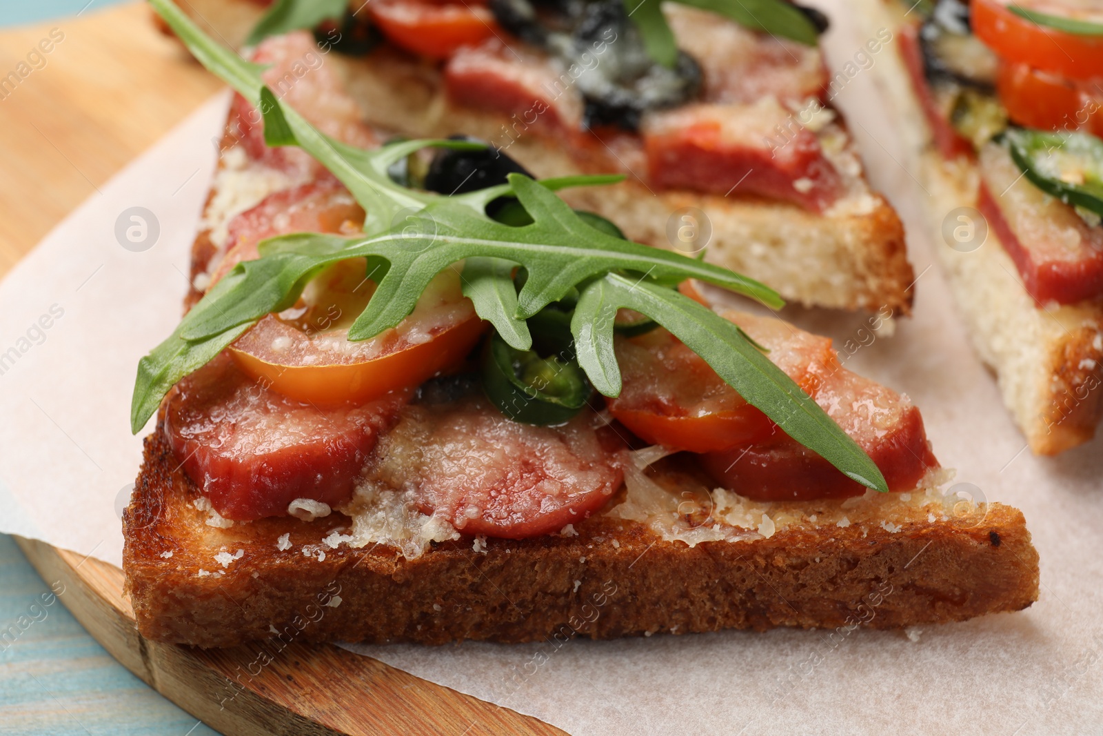 Photo of Tasty pizza toasts on table, closeup view