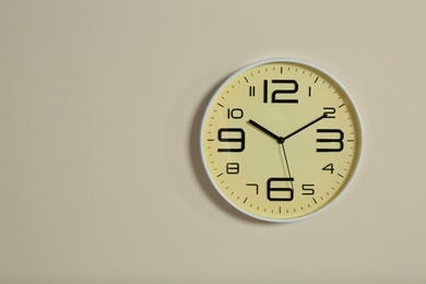 Photo of Stylish clock and space for text on color background. Time management