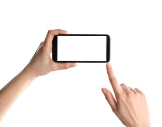 Woman holding smartphone with blank screen on white background, closeup of hands. Space for text