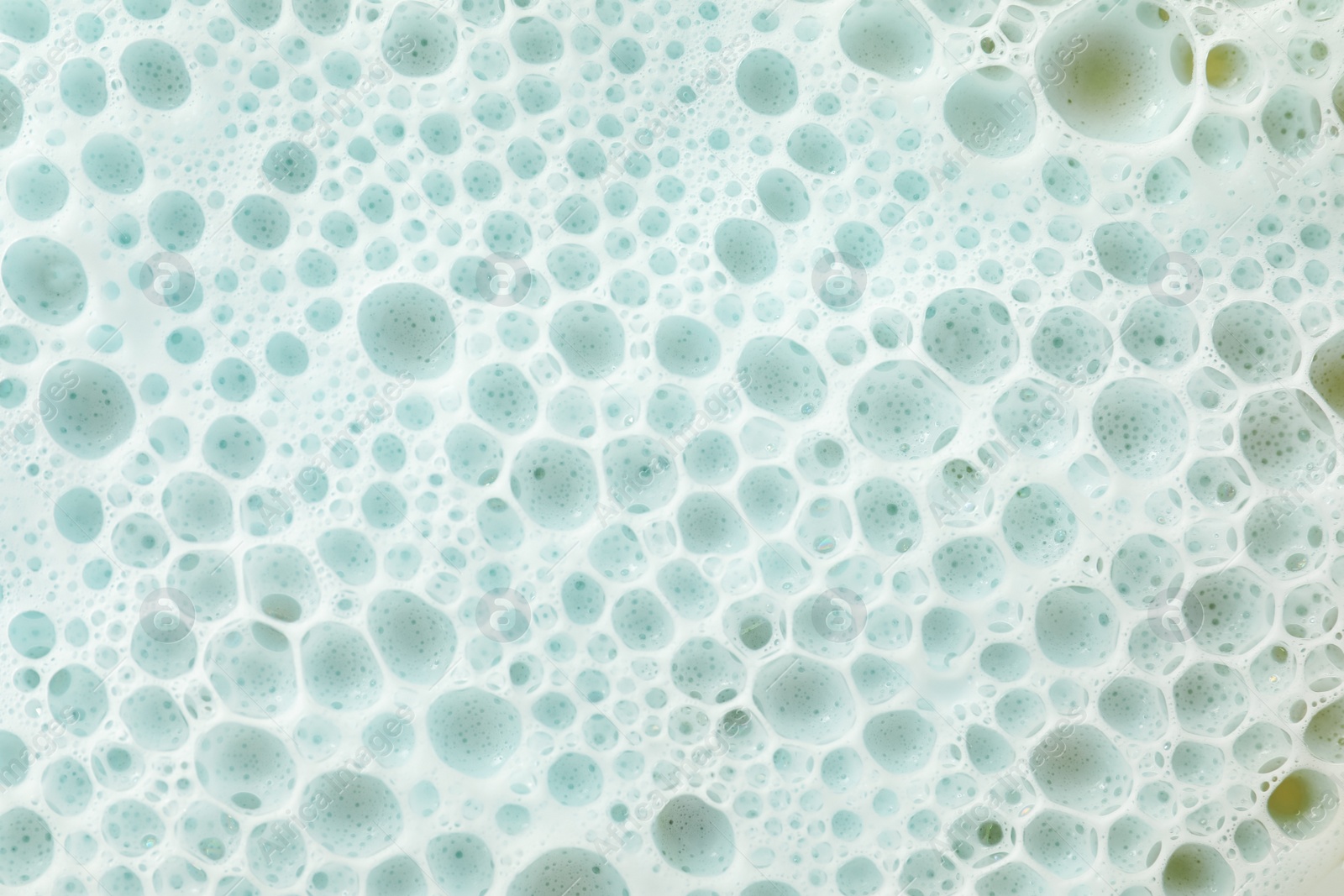 Photo of Color washing foam as background, top view