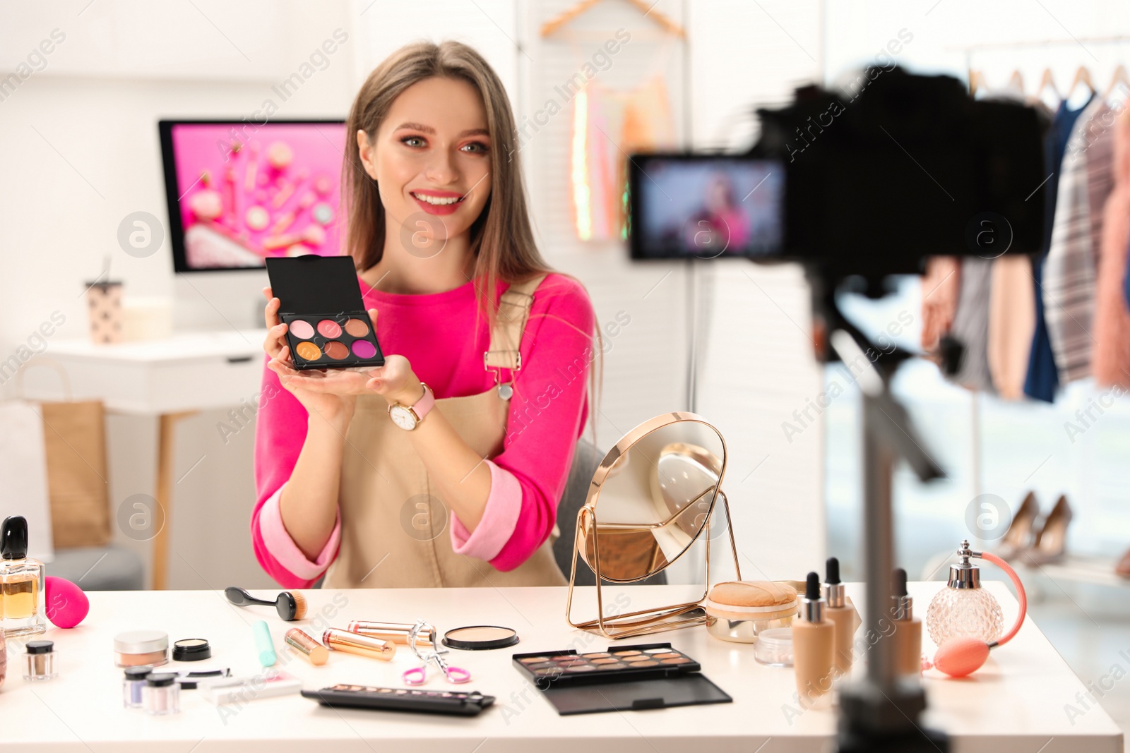 Photo of Beauty blogger filming make up tutorial at home