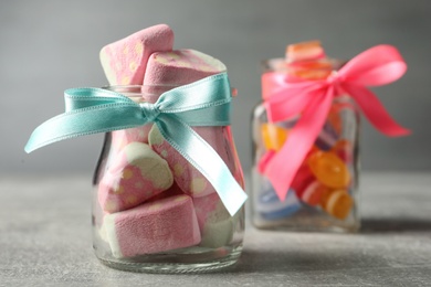 Tasty sweets on light grey table, closeup. Space for text