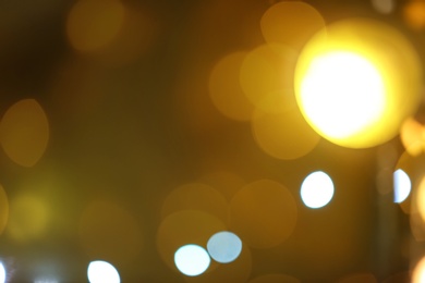 Blurred view of beautiful lights on dark background. Bokeh effect