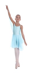 Photo of Beautifully dressed little ballerina dancing on white background