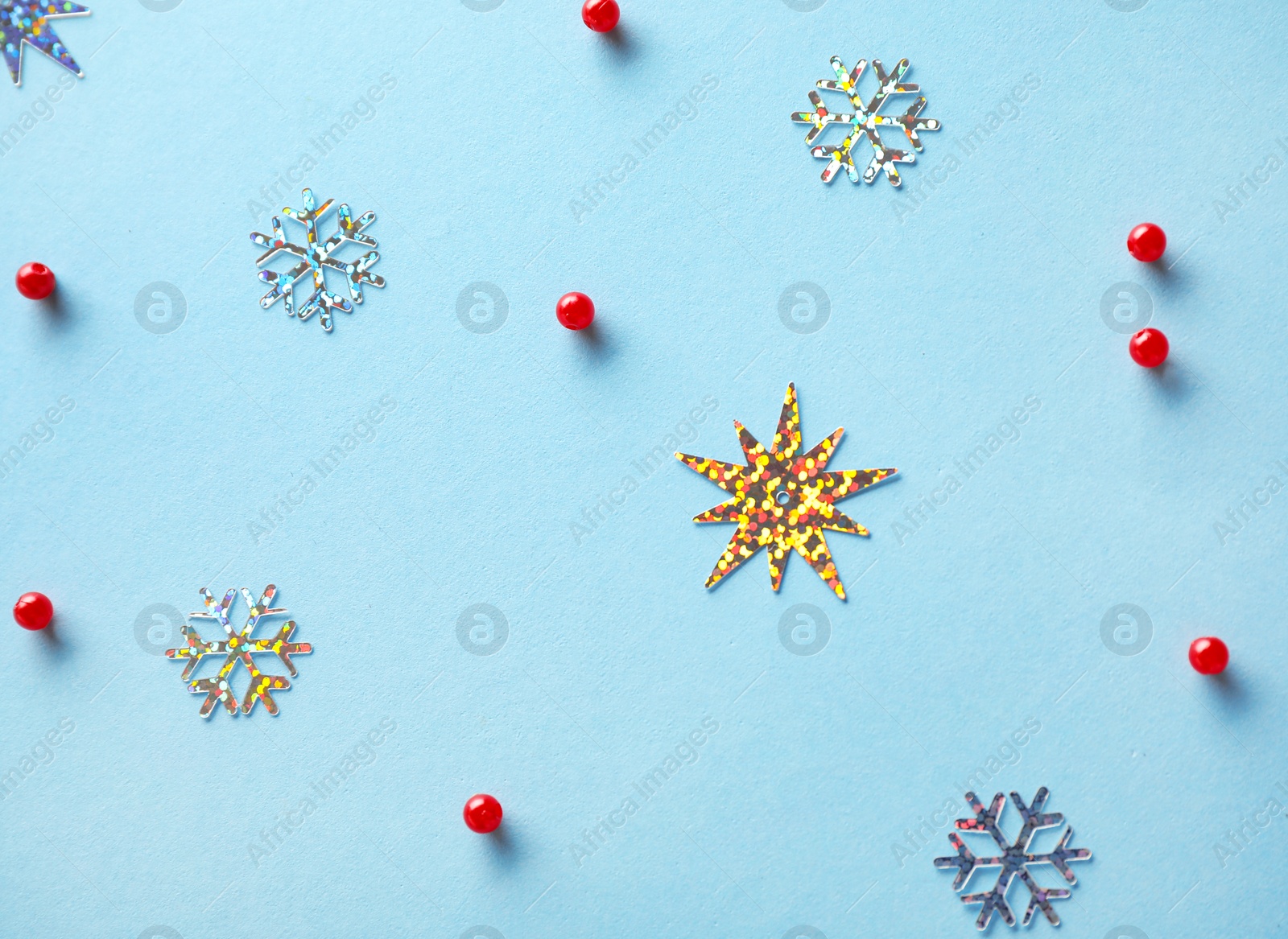 Photo of Flat lay composition with Christmas decorations on light blue background