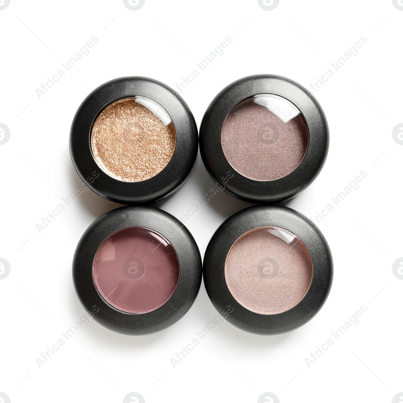 Photo of Different eye shadows on white background, top view. Decorative cosmetics