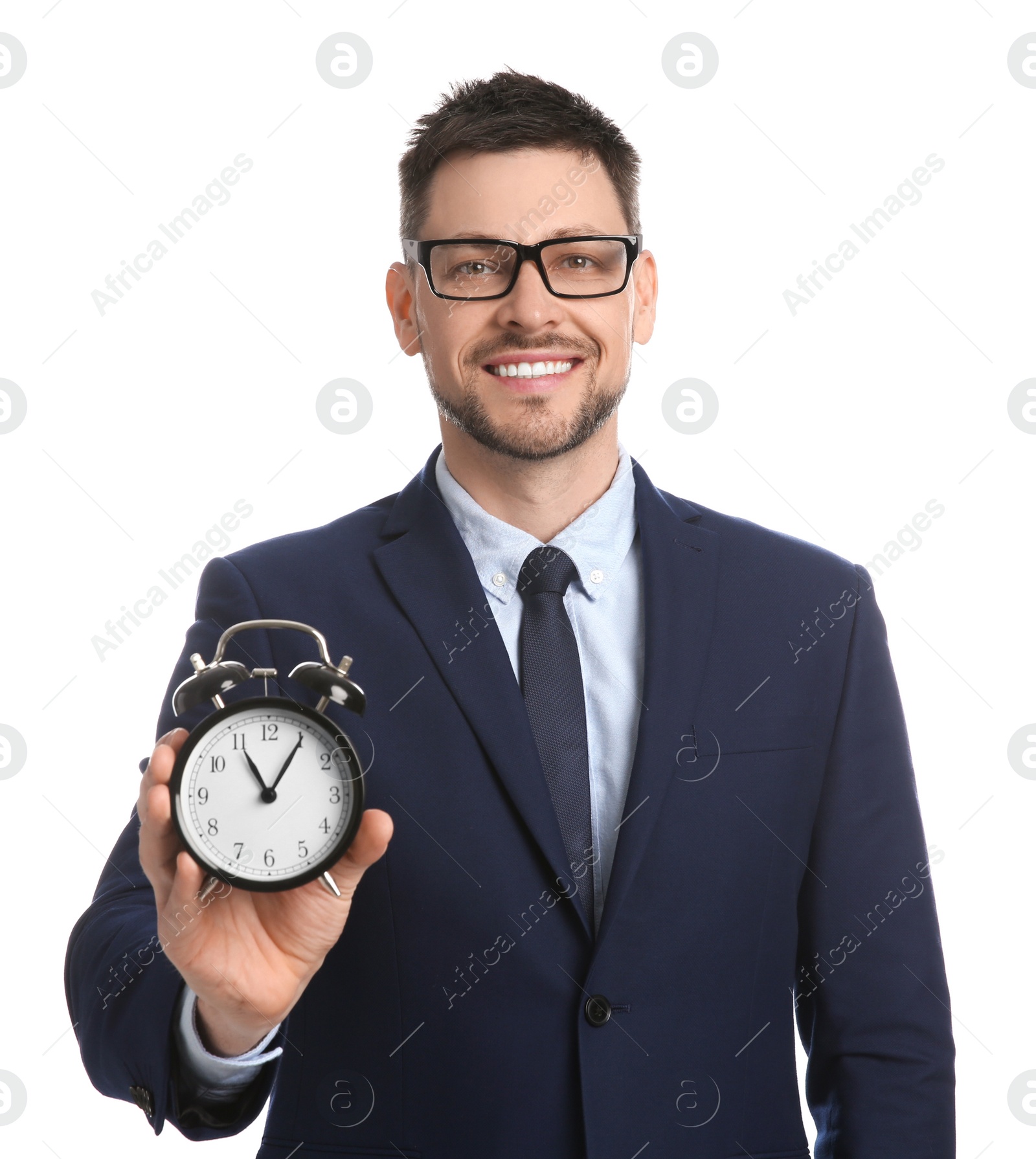 Photo of Happy businessman holding alarm clock on white background. Time management