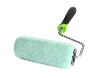 Photo of New paint roller brush on white background