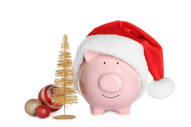 Composition with piggy bank and Christmas decor on white background